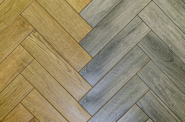 Fototapeta premium Texture of different motley boards laid diagonally. Background, corner parquet. laminate floor