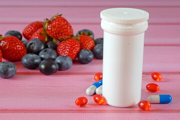 fresh natural fruits vs pills. Natural vitamin in fruits vs synthetic vitamin in pills. Choice between natural and synthetic way of health care. Alternative medicine.