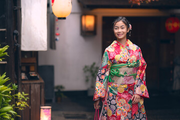 Fototapeta premium Asian traveler girl in Kimono traditional dress walking in old temple in Kyoto city