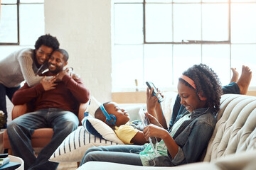 Tablet, relax and black family children, parents or African people happy together, bond and enjoy...