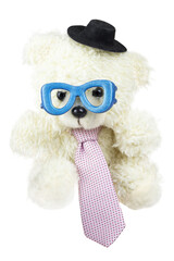 Fototapeta premium Cutout of an isolated white fluffy teddy bear wearing blue glasses, a black hat, and a pink tie with the transparent png 