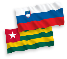 Flags of Slovenia and Togolese Republic on a white background