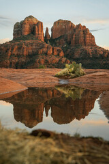 Reflection photo taken at sunset in Sedona Arizona United States Yavapai County at sunset in winter of Cathedral Rock illuminated with reds and oranges