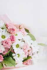 Background of beautiful bouquet of rose and chrysanthemums flowers. Backdrop for holiday, birthday, Wedding, Mother's Day, Valentine's day, Women's Day. Floral arrangement.