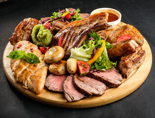 grilled potatoes and meat with various sauces and greens