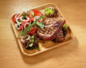 grilled potatoes and meat with various sauces and greens