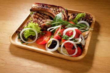 grilled potatoes and meat with various sauces and greens