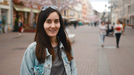 A young beautiful girl travels around the city.