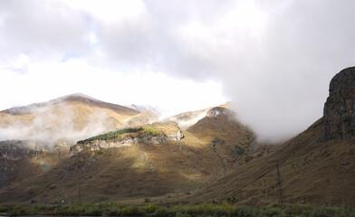 Beautiful autumn mountain landscape of the Caucasus mountain range in Kazbegi, Georgia.