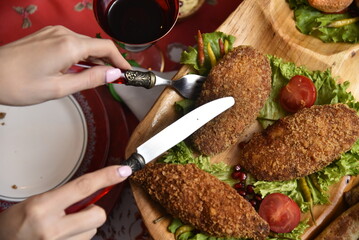 kiev cutlet shaped with tomato and lettuce leaves