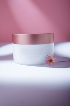 Face Skin Cream Or Hair Conditioner, Balm Container On White Table, Pink Backdrop In Harsh Light With Dry Flower. Cosmetics Mockup Template