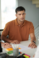 Young man visiting lawyer or insurance agent to get consultation