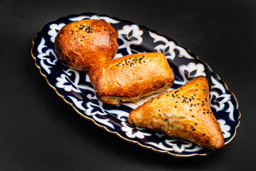 Puff pastries with meat samosa samsa - traditional uzbek and indian pasrty.