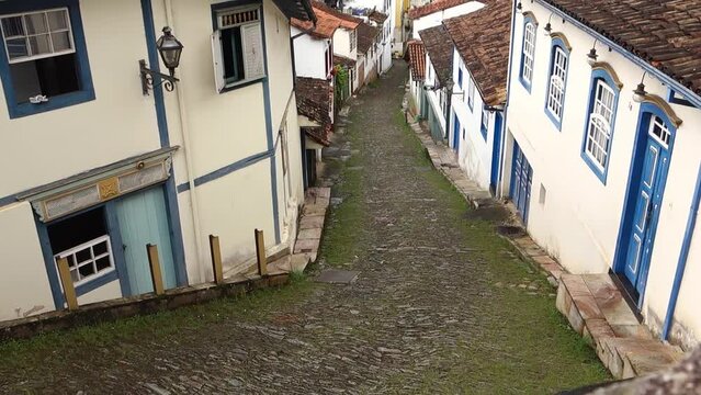 narrow cobbled street with baroque style buildings in Ouro Preto, MG, Brazil. World Heritage Site by UNESCO