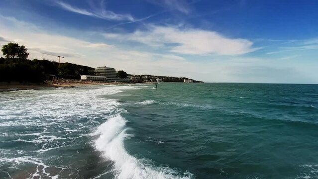blue waves and Statue of Neptune