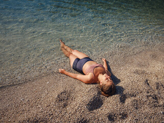 Cheerful woman enjoying the beach