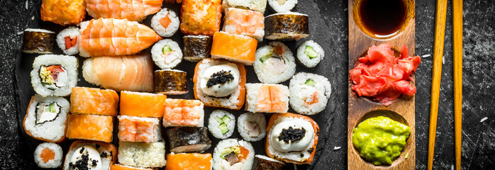 Fresh sushi rolls with vegetables, shrimp and salmon.