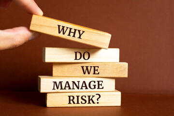 Wooden blocks with words 'Why do we manage risk?'.