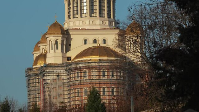 4K video with People's Salvation Cathedral (Catedrala Mantuirii Neamului in Romanian language) building under construction. Tilt camera movement. Bucharest, Romania, 2023.