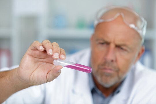 senior male researcher carrying out scientific research in a lab