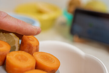 Man cooking delicious and healthy food with online video lesson