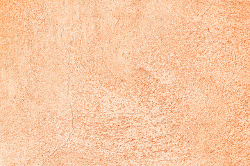 Beige abstract background, plaster texture, old painted facade of the building, with a crack.