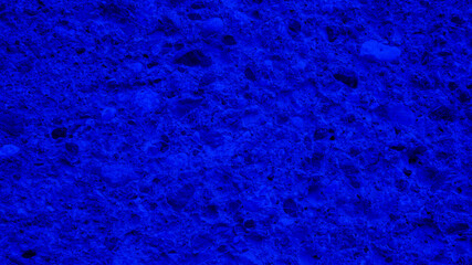 Dark blue texture of porous stone, sponge. Natural background.