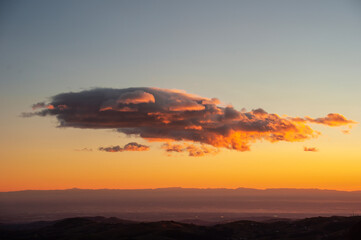 Beautiful mountain sunset with red clouds