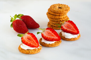 cookies with ricotta, cheese cream and fresh strawberries on a marble board. Idea for culinary recipes and desserts. Perfect party concept. Valentin's Day