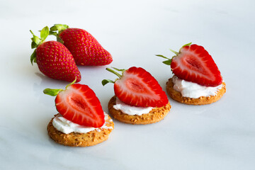 cookies with ricotta, cheese cream and fresh strawberries on a marble board. Idea for culinary recipes and desserts. Perfect party concept. Valentin's Day