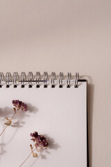 White paper notebook on beige background, writing aesthetic