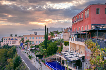 Taormina, Sicily, Italy. Cityscape image of picturesque town of Taormina, Sicily with volcano Etna...