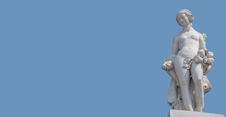 Banner with an old roof statue of a beautiful sensual Renaissance Era woman with flowers in Potsdam at blue sky solid background with copy space, Germany. Concept of historical architecture heritage