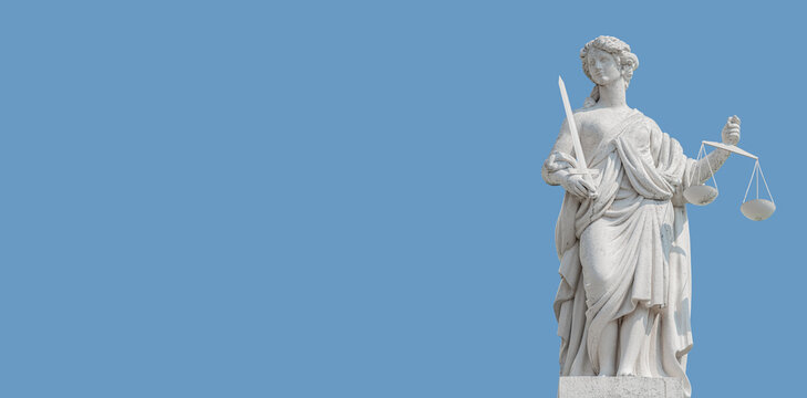 Banner with an old statue of goddess Justice with scales and sword at blue sky solid background in Potsdam, Germany, with copy space. Concept of historical architecture heritage
