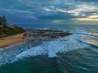 Sunrise over the ocean with clouds