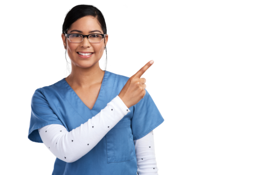 Portrait of a young doctor wearing glasses and scrubs, pointing to her left Isolated on a PNG background.