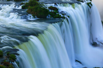 Naklejka na ściany i meble The incredibly beautiful Iguazu Falls on the border between Brazil and Argentina.