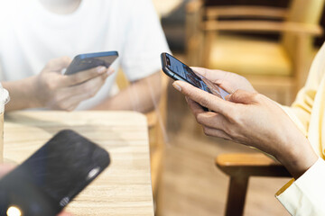 Closeup Group of Adults engineer Friends Sitting Couch Using Hands Modern Smartphone Tablets Start Business Friendship, Teamwork, Collaboration Concept