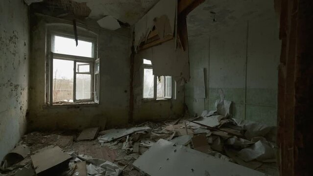 Viewing shabby forsaken rooms with garbage