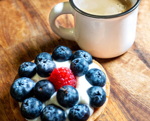 Freshly baked baskets with curd cream  and strawberries 