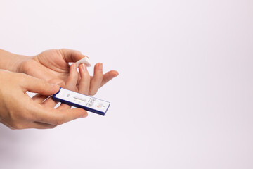 Hand holding rapid test for hepatitis. Negative test for hepatitis. Closeup