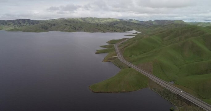 Lake of San Luis Reservoir in Background near Los Banos and Upper Cottonwood Creek Wildlife Area. Highway in Foreground. California. USA
