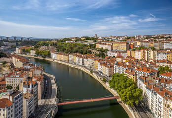 Fototapeta na wymiar The drone aerial view of Saone River runs through the downtown district of Lyon, France.