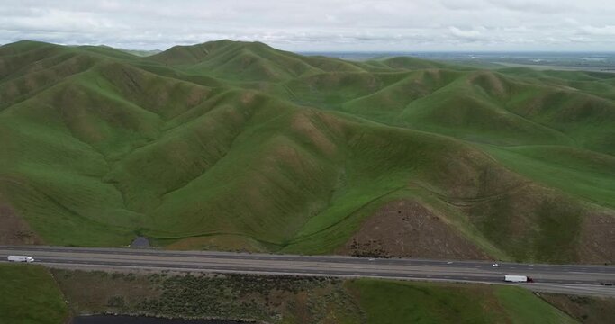 Upper Cottonwood Creek Wildlife Area with San Luis Reservoir in Background near Los Banos. California. USA. Mountains and State Road