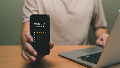 Selective focus at finger of business man while point finger to choose feedback on excellent customer service with five star score with smile. Service evaluation concept with futuristic icon.