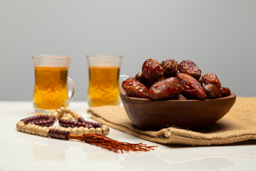 Ramadan food Sweets mixed of dried fruits, Dates premium dates, 
full of date fruits, Arabic coffee, Concept: month fasting culture Muslim prayer, 
1444 Puasa Ramadan Kareem greeting festival
