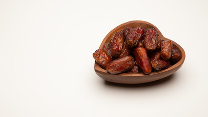 Ramadan food Sweets mixed of dried fruits, Dates premium dates, 
full of date fruits, Arabic coffee, Concept: month fasting culture Muslim prayer, 
1444 Puasa Ramadan Kareem greeting festival
