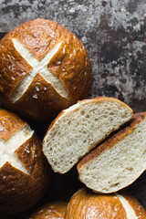 Pretzel buns on a baking sheet, German laugenbroetchen, lye buns on a baking tray