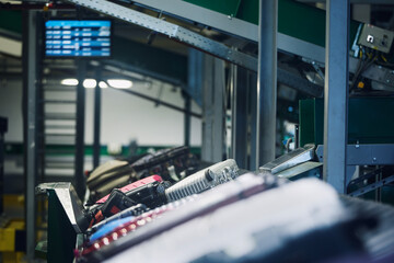 Lot of luggage on conveyor belt. Baggage sorting at airport. Traveling by airplane. .