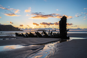 Wreck of Helvetia at sunset, Rhossili Bay beach, no people. Gower Peninsula, South Wales, the...